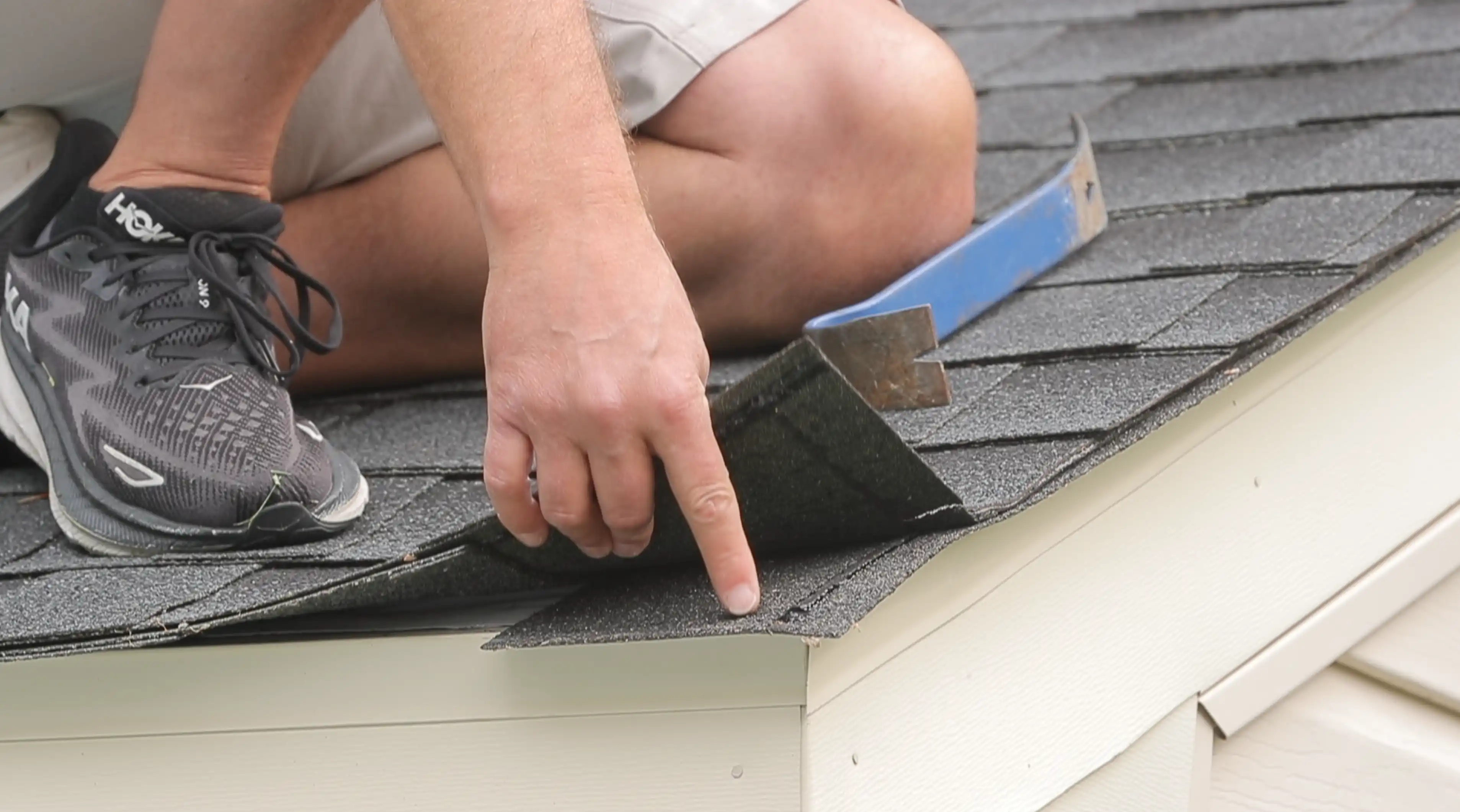 Man inspecting a roof